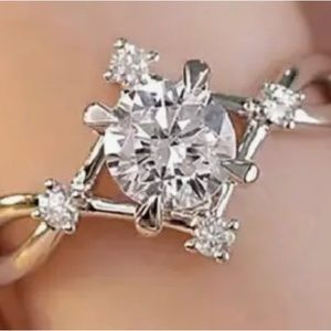 One carat round zirconia set in sterling silver plating with four zircons Size 9